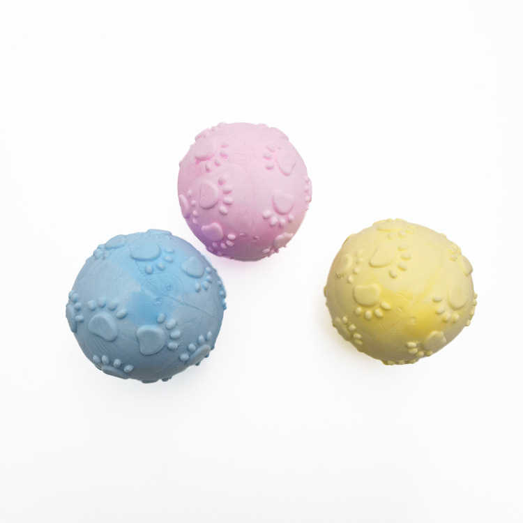 Transfronterizo juguete para mascotas huellas de espuma TPR bola mordedura molar sabor a leche bola sólida fábrica de juguetes para perros