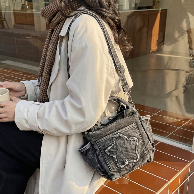 Europa y los Estados Unidos retro vaqueros bolsas de hombro para hombres y mujeres bolsas de estrellas portátiles ligeras y casuales 2026 nueva versión coreana bolsas para niños