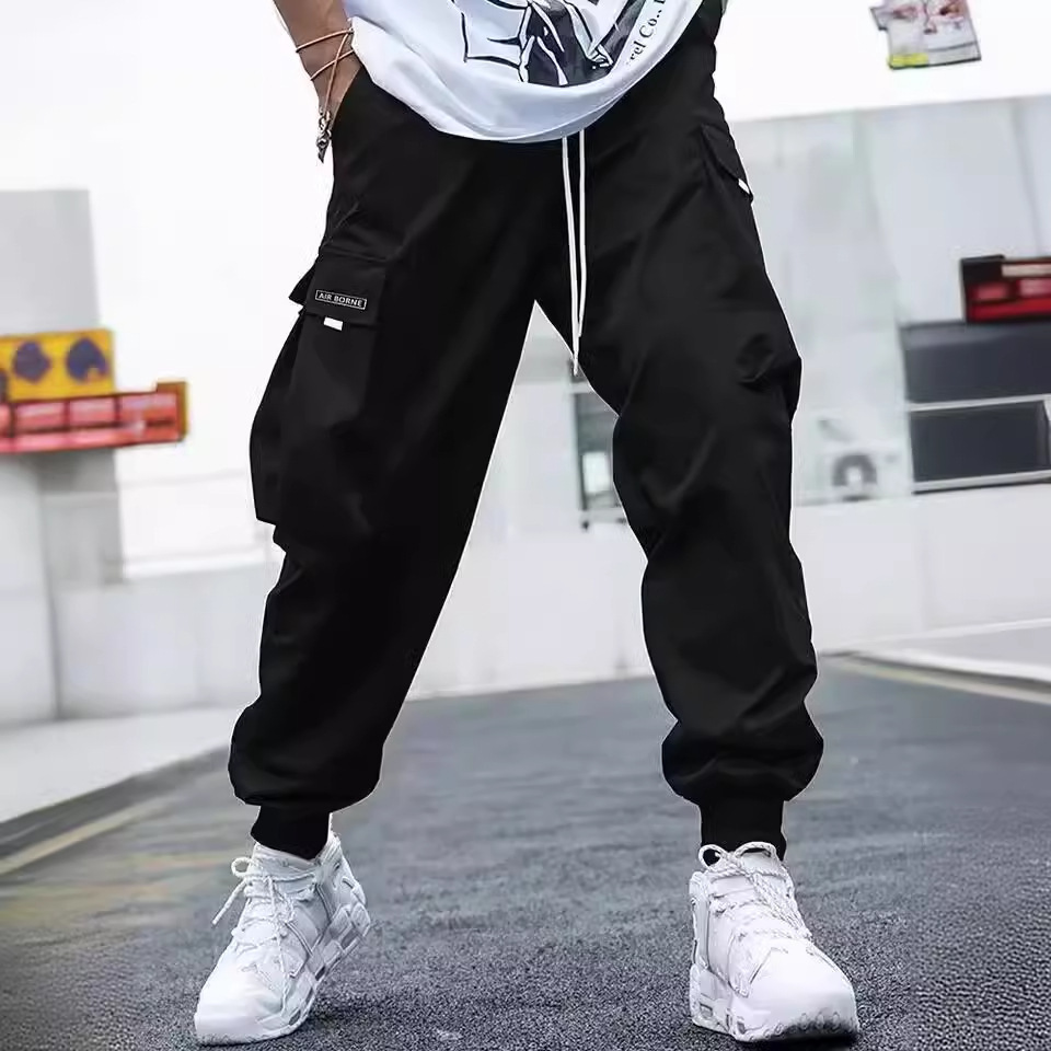 Nuevos monos transfronterizos Pantalones casuales delgados de verano 2025 para hombres Pantalones sueltos de diseño de varios bolsillos