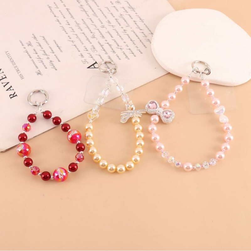 Fashionable new diamond-encrusted Saturn wrist phone pendant, ins niche design pearl beaded keychain accessory Fashionable new diamond-encrusted Saturn wrist phone pendant, ins niche design pearl beaded keychain accessory