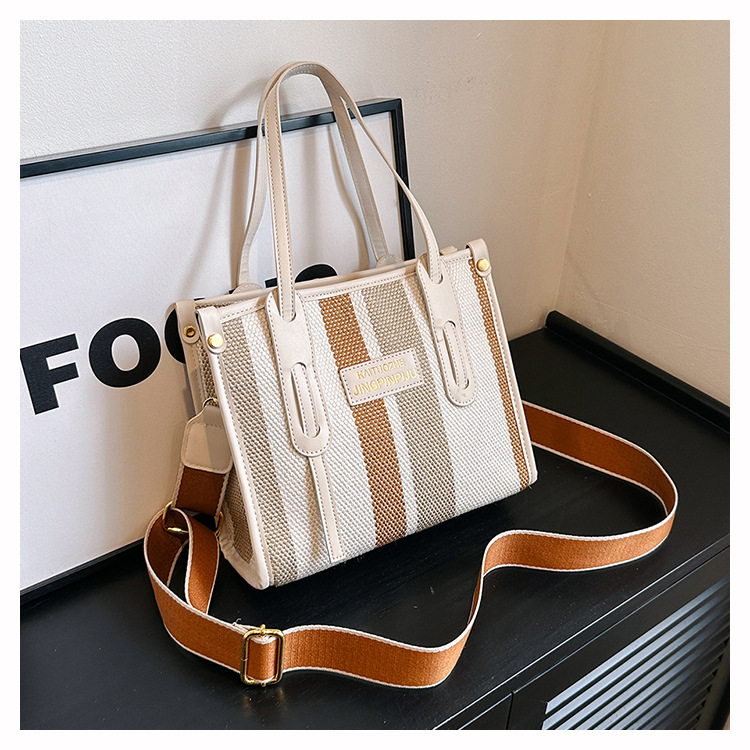 Bolso Tote portátil a rayas de color de contraste de lona para mujer 2024 nueva textura de moda transfronteriza bolso de mensajero de un solo hombro