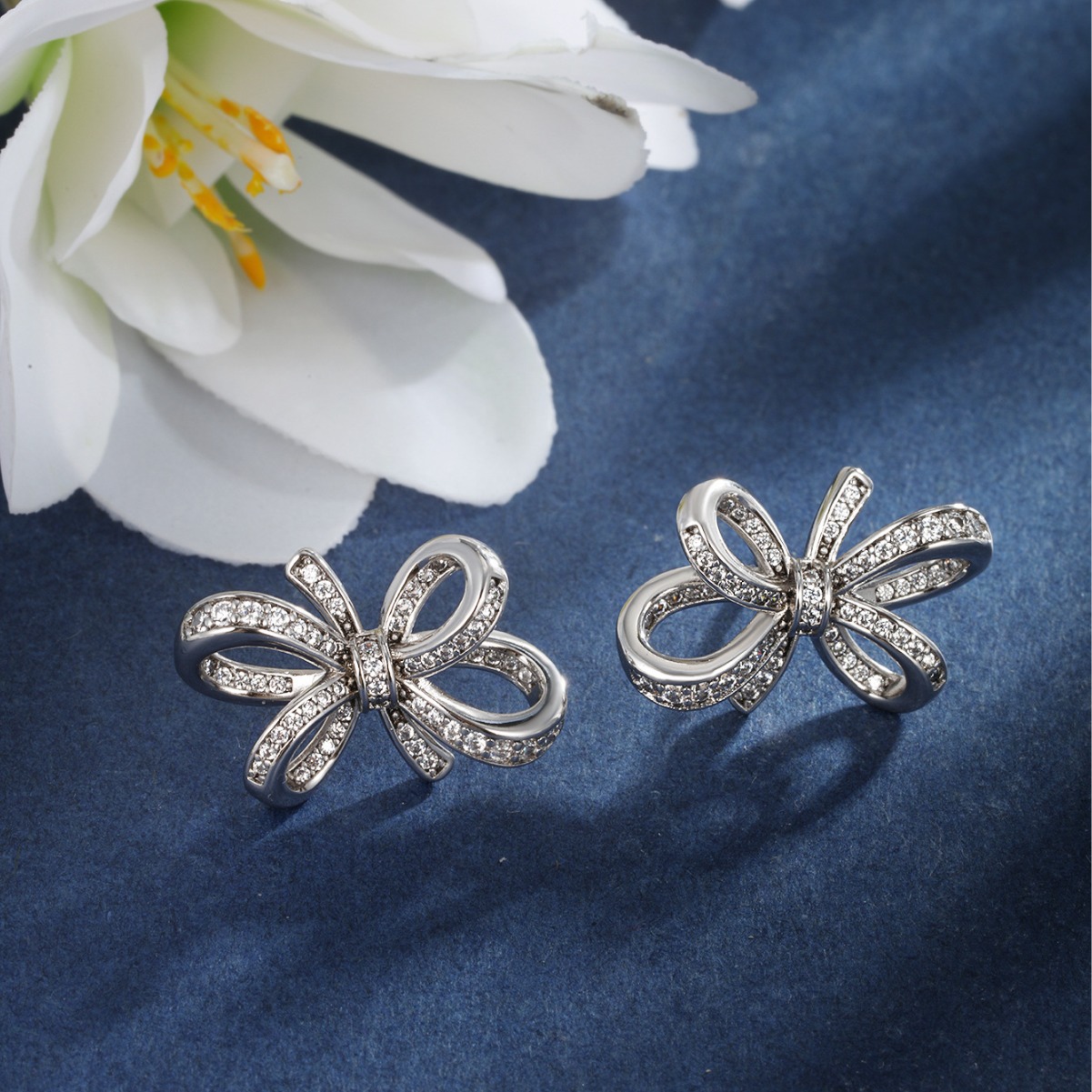 Joyería Xuping arco de bronce de piedra arco pernos de orejas de lujo nicho ligero japonés y coreano aretes dulces mujeres