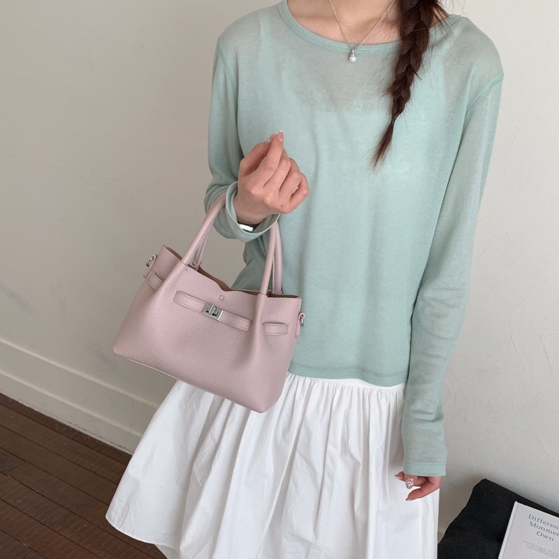 Simple portátil 2026 diseño de bolso de hombro único versátil estilo coreano de transporte de moda nuevo bolso de cubo nicho femenino