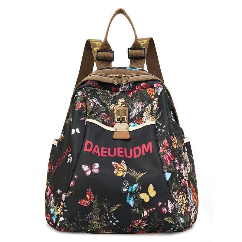 Perezoso viento alto valor de la cara explosivo estilo de moda extranjero anti-sucio damas mochila de viento 2025 mochila de viaje