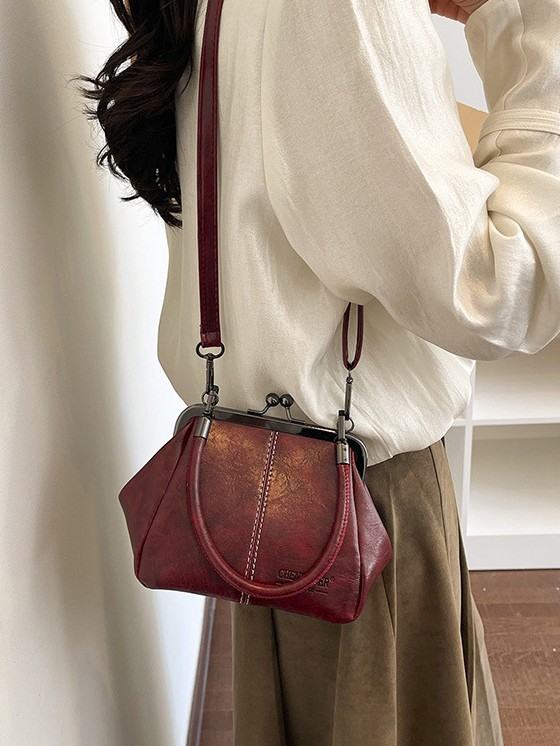 Bolso de conchas de moda para mujeres 2026 comercio exterior nuevo bolso coreano de abrazadera alta sensación retro versátil mochila