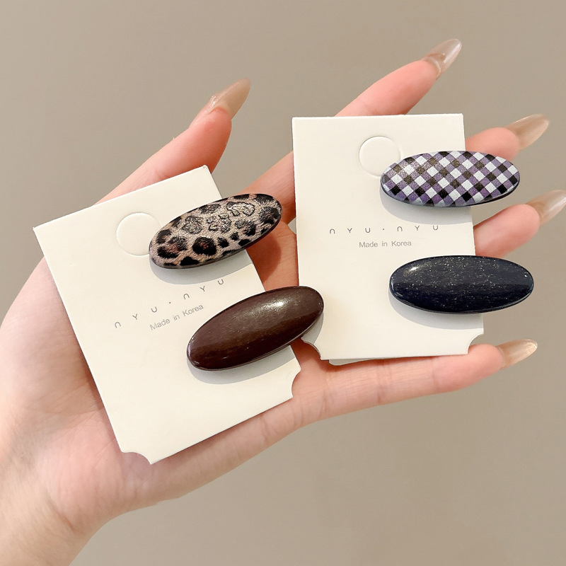 Temperamento Horquilla de ácido acético Horquilla rota lateral con estampado de leopardo 2025 Nuevo clip de pico de pato estilo retro de Hong Kong Tocado de horquilla simple