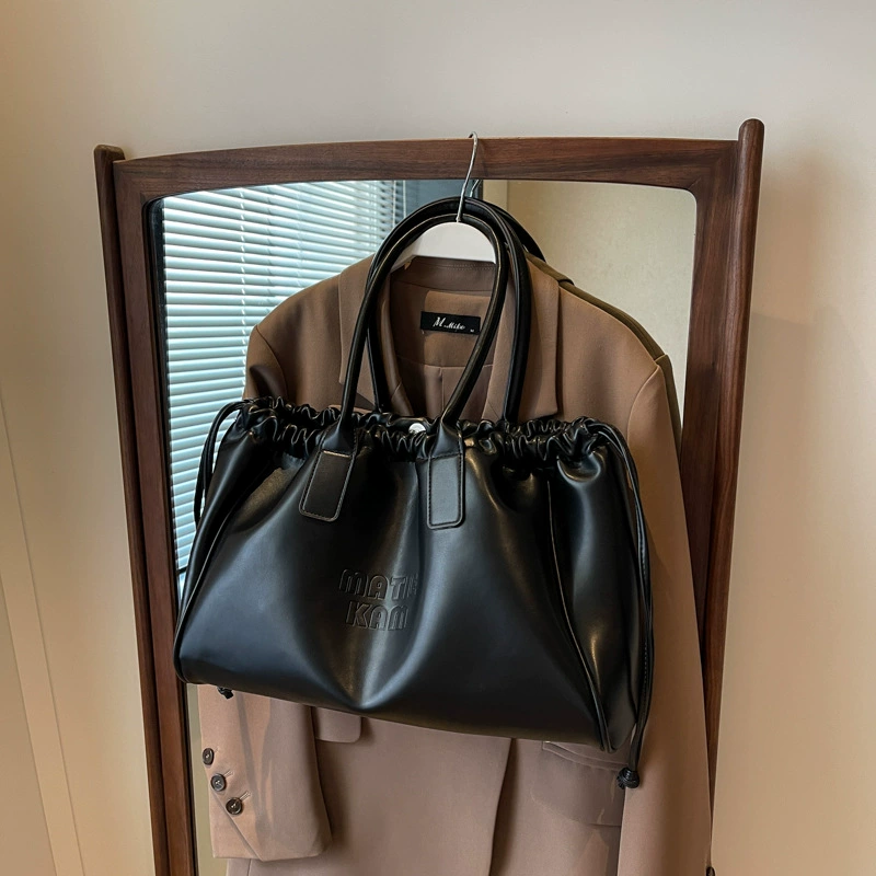Universal small design shoulder bag, capacious one-shoulder bag, 2023 collection, genuine leather, drawstring
