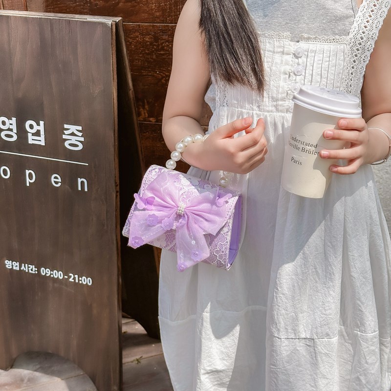 Bonito pequeño viento de la princesa viento bolso de perlas bolso de mano bolso de hombro para niños arco