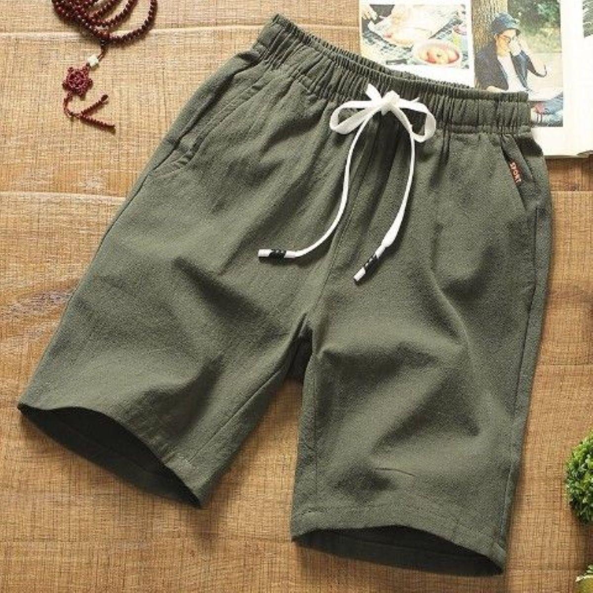 Pantalones cortos casuales pantalones finos de cinco puntos de algodón y lino para hombre, pantalones sueltos de color sólido, pantalones de todo fósforo, estilo coreano, hermosos pantalones cortos de playa, marea