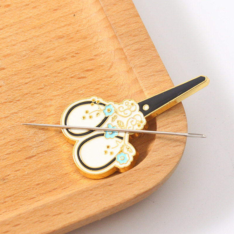 Fabricante al por mayor herramienta de succión de agujas retro punto de cruz costura de flores DIY magnético pequeño recolector de agujas magnético