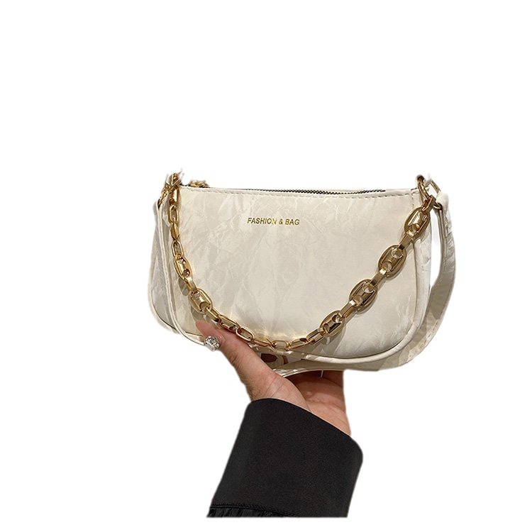 Popular 2024 nuevo viaje de invierno mochila de hombro de textura de moda mochila de nicho de diseño de cadena bolso debajo de la axila