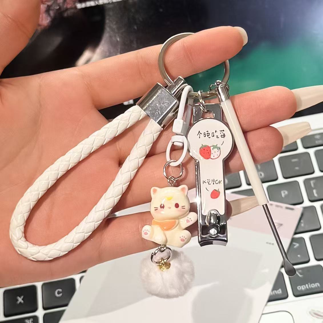 Beige pendant, strawberry, nail scissors, ear picking