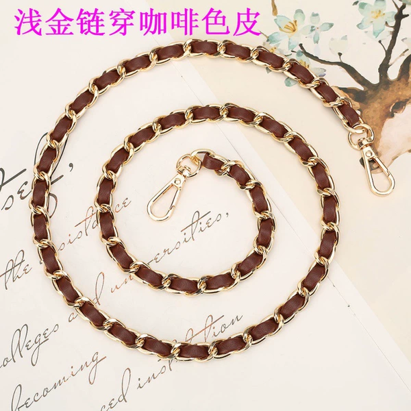Light gold chain wearing brown leather