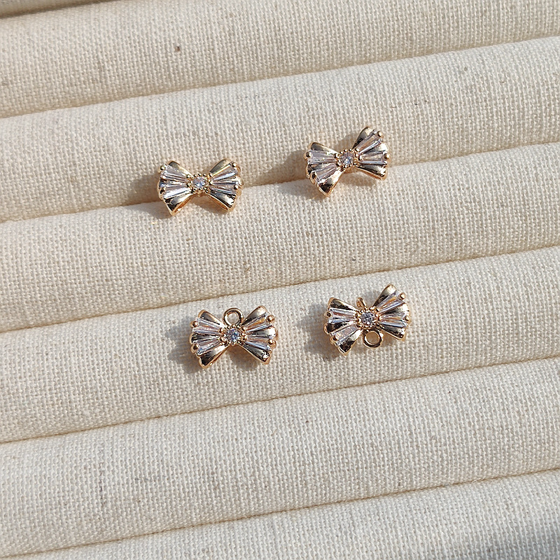 Copper earrings with zircon with bow