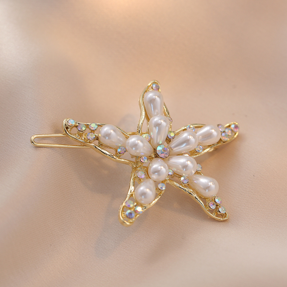 Women's Simple Style Shiny Starfish Rhinestone Hollow Out Inlay Rhinestones Pearl Hair Clip display picture 1