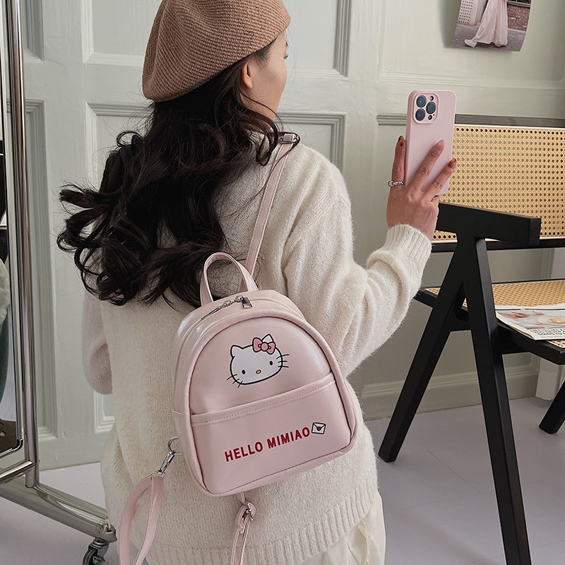 Mochila de moda encantadora mochila de clase de viento mujer de viaje temperamento universal gato 2026 mini niña nueva