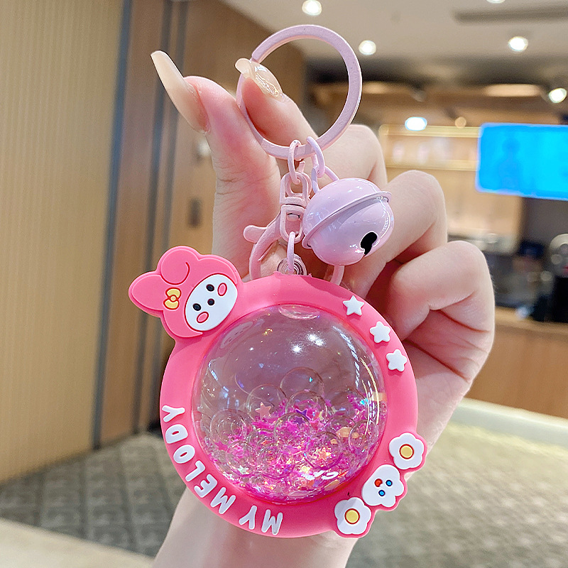 En línea de la celebridad de dibujos animados KT cristal coche llavero mujer libro bolsa colgante pequeña joyería aceite arenas movedizas estrella Delu colgante creativo