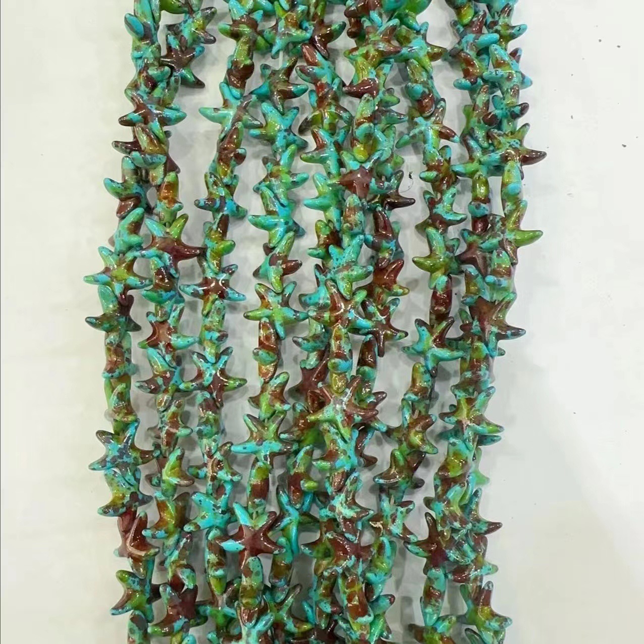 Ventas transfronterizas de coloridas estrellas de mar de piedra de pino cuentas semiacabadas DIY accesorios accesorios materiales de joyería hecha a mano