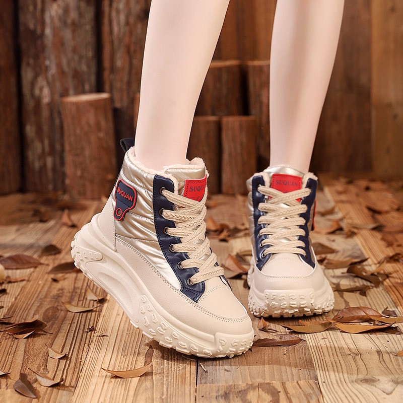 Botas de nieve de invierno de mujeres 2025, una nueva piel en una calentadora zapatillas deportivas cómodas y zapatos de algodón gruesos para mujeres