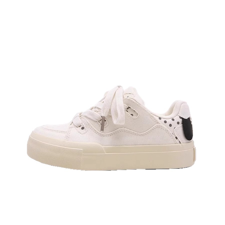 Zapatos blancos de suela gruesa para mujeres, primavera y verano de 2025, nuevos zapatos de skate casuales lindos zapatos de pan para perros para mujeres