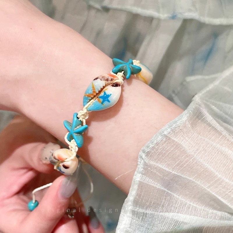 Braccialetto di perline di riso fresco ed elegante con conchiglia di stella marina in stile naturale per le vacanze al mare_voghion.com