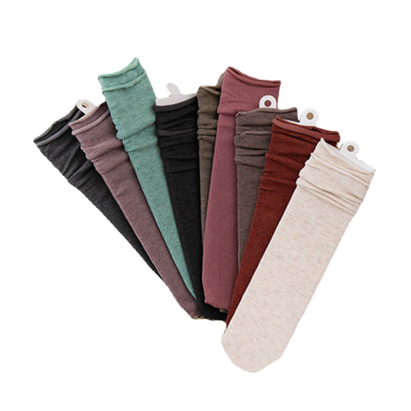 Otoño e invierno nuevos calcetines de rayas retro calcetines de algodón de media pantorrilla de color sólido japonés para mujer ins JK calcetines de mujer al por mayor