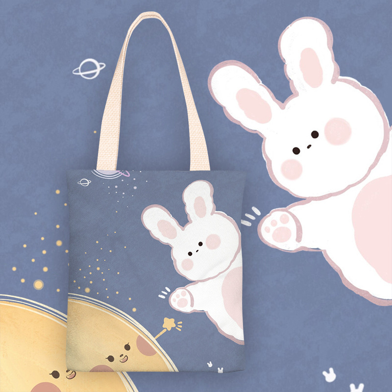 新款卡通遨游太空的兔兔学生单肩手提袋帆布袋大容量包包购物袋