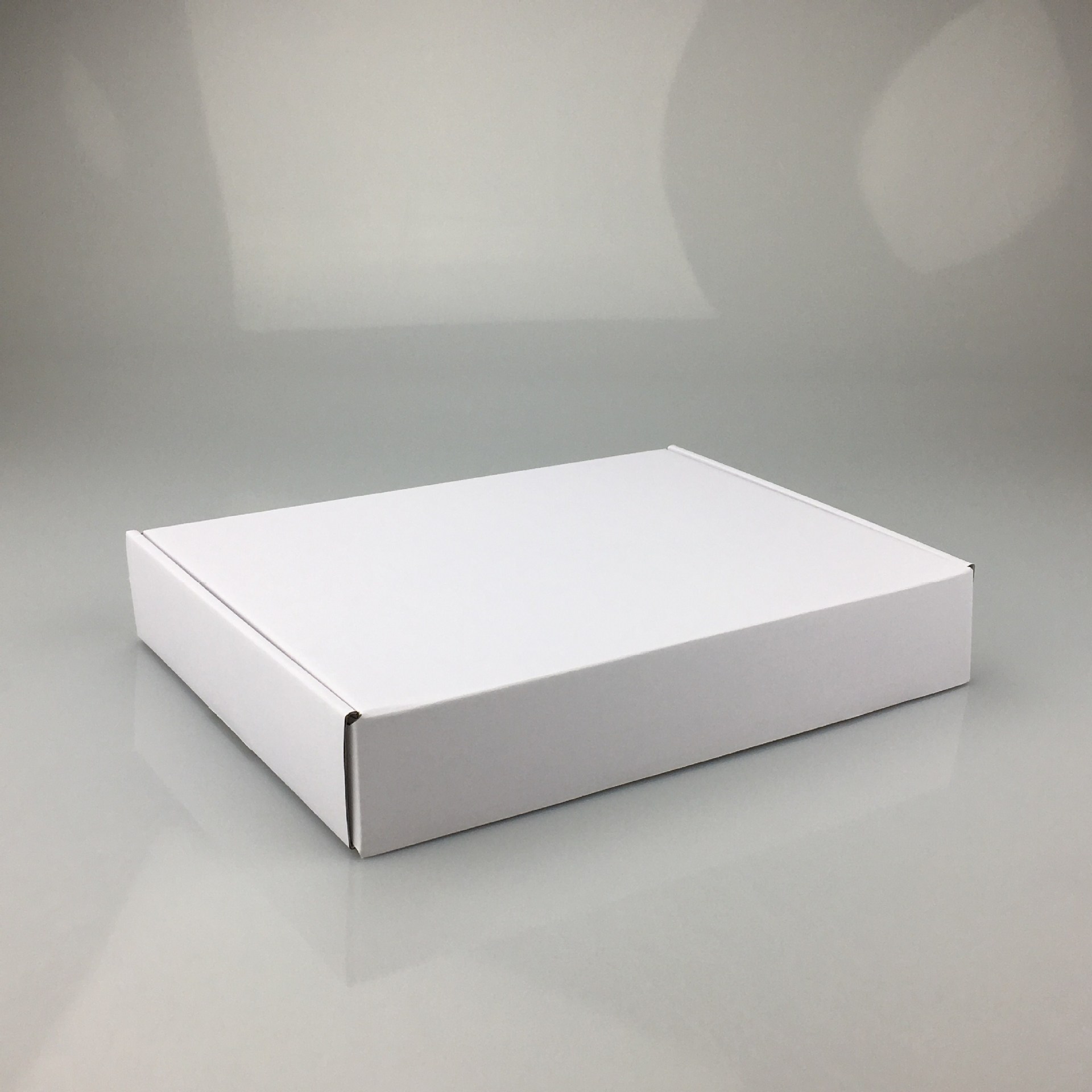 Caja de papel expreso, caja de avión, caja negra blanca, caja de embalaje de envío gratis, caja de embalaje de lotes pequeños, cuadrado pequeño