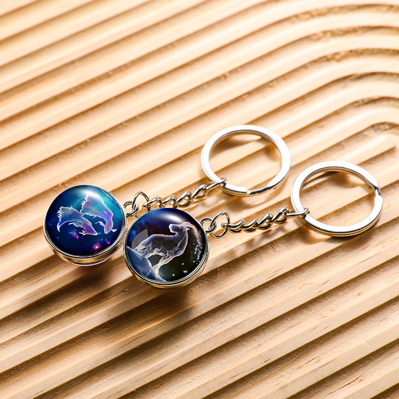 Transfronterizo 12 constelaciones de luz nocturna bolsos colgantes de bolsas de joyas de tiempo doble cara bola de vidrio llavero al por mayor