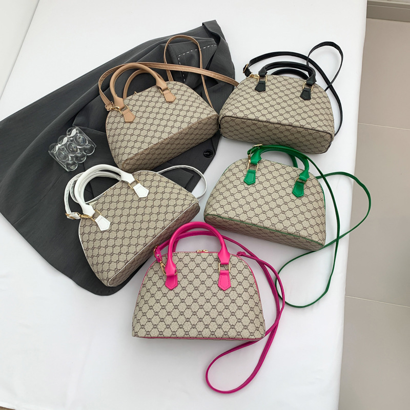 Bolso de moda simple 2024 primavera nueva bolsa de hombro de viaje de estilo extranjero bolso de mano casual bolso de concha de mujer