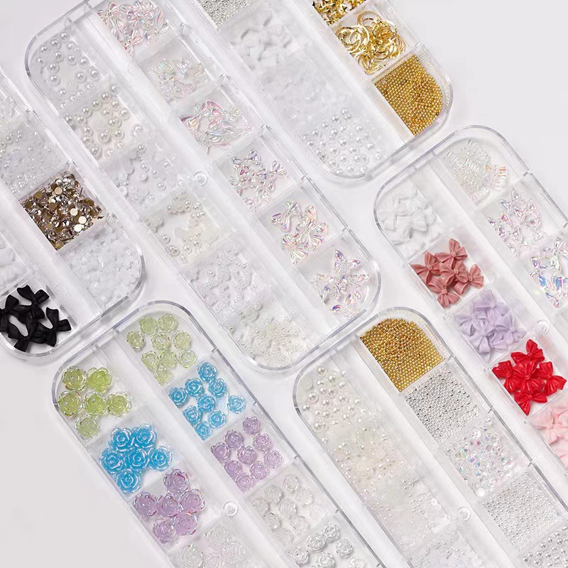 Joyería de uñas Aurora arco perla remache pequeños accesorios Super Flash pequeño diamante 12 rejilla mixta decoración de uñas al por mayor