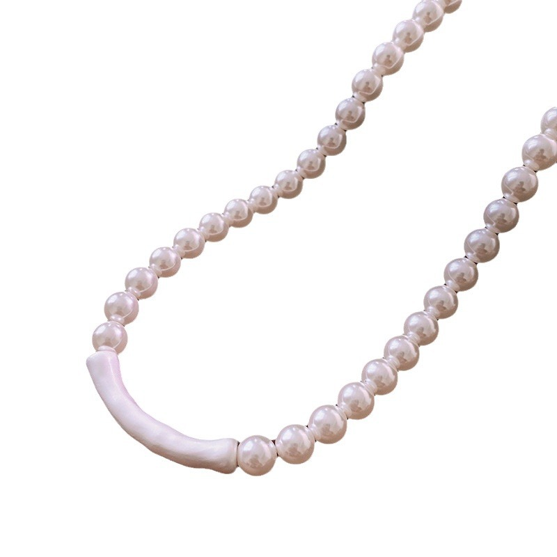 Collar de perlas con lazo de súper hada, cadena de clavícula de moda de lujo ligero francés, sentido de alta gama, joyería de nicho de arte, mujer al por mayor