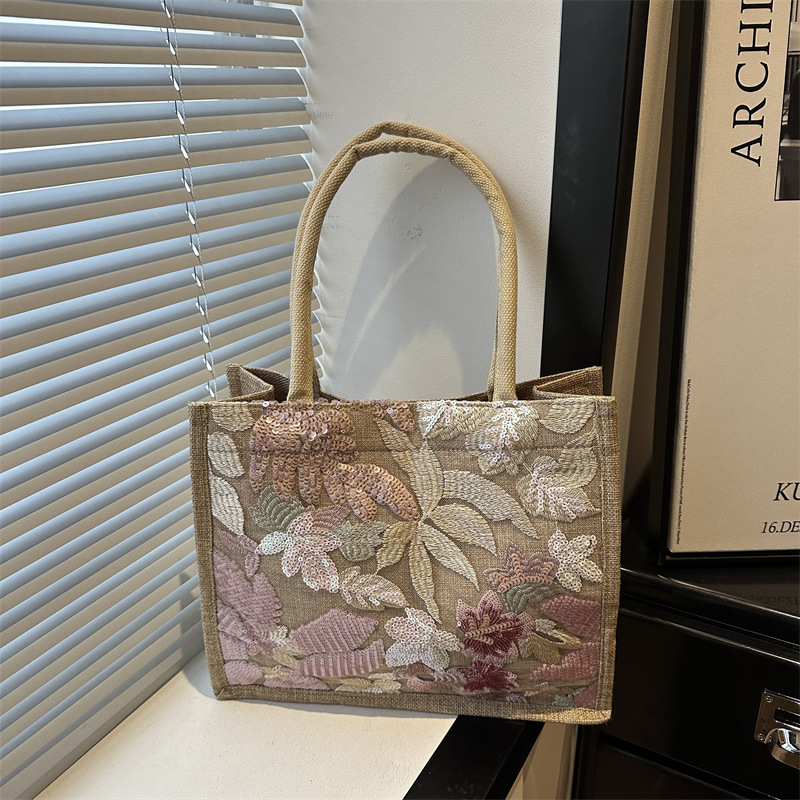 Explosiones transfronterizas 2026 textura de lino de alta calidad, flores bordadas, bolsas de tendencia horizontales, bolsas de compras de aire exterior