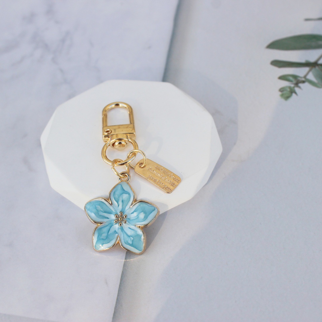 Nueva venta caliente transfronteriza, estilo caliente, flor de cinco hojas coreana, flor de pera, colgante, llavero, bolso Zou Ju, colgante, regalo pequeño