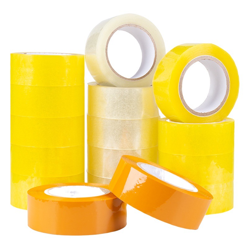 Una gran cantidad de cinta adhesiva ancha al por mayor cinta adhesiva rollo grande cinta de sellado de caja completa cinta adhesiva amarilla cinta de embalaje exprés embalaje