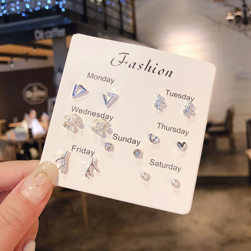 Luz de lujo de alto nivel nicho de diseño femenino sensación de aretes de bordilla temperamento perla asimetría joyería perla al por mayor