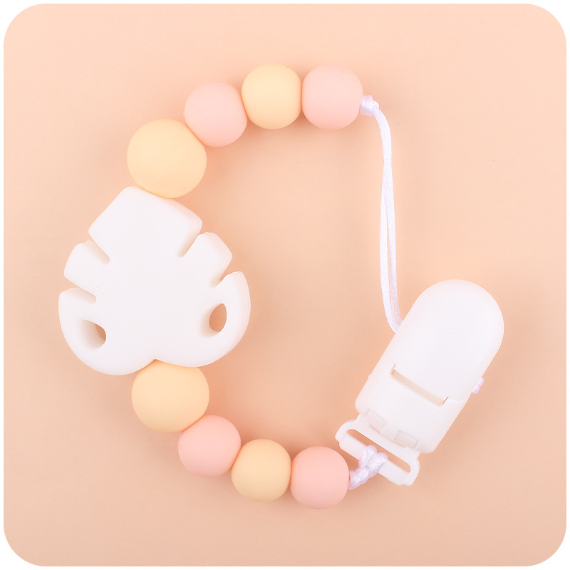 Suministros para bebés chupete cadena creativa bebé dibujos animados hojas silicona mordedura cadena anti-gota molar Nuevo