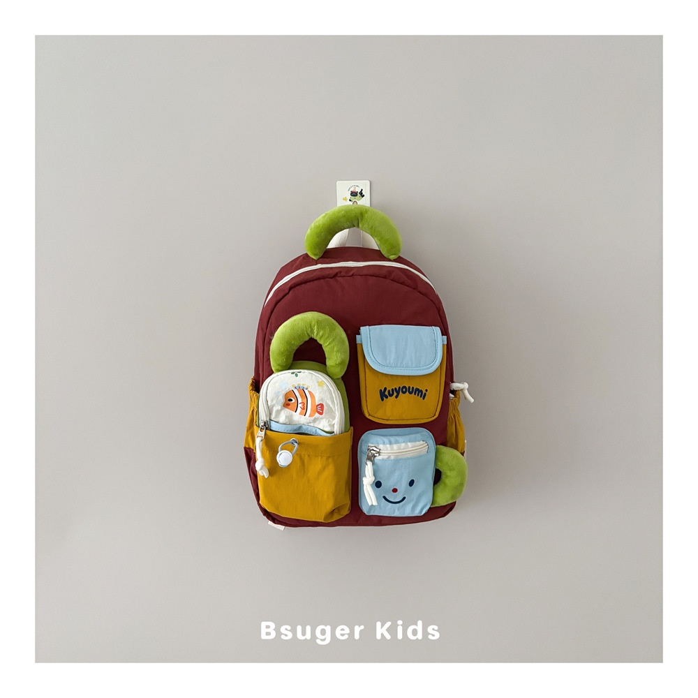Color-blocked children's backpack with cartoon fish and smiley face pockets, lightweight school bag for kids' outings