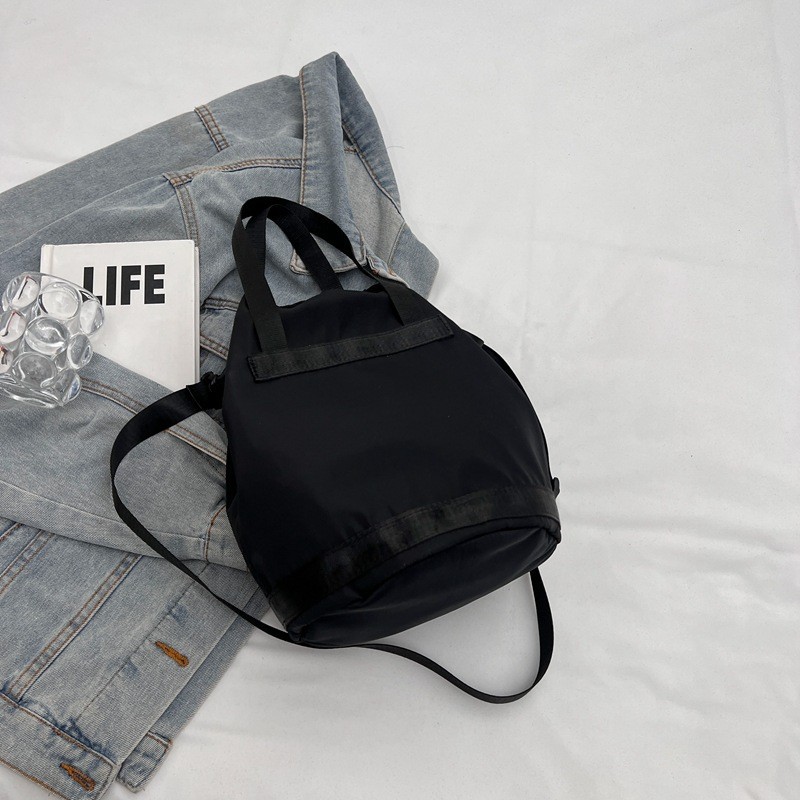 Fabricantes al por mayor 2024 primavera nuevas señoras bolso de cubo de nailon moda todo fósforo ligero bolso diagonal de un solo hombro bolso femenino