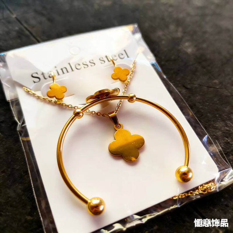 Children's Golden Four-Leaf Clover Simple Elegant Stainless Steel Fashionable Stylish Versatile Accessible Luxury Earrings Necklace Bracelet Set Children's Golden Four-Leaf Clover Simple Elegant Stainless Steel Fashionable Stylish Versatile Accessible Luxury Earrings Necklace Bracelet Set