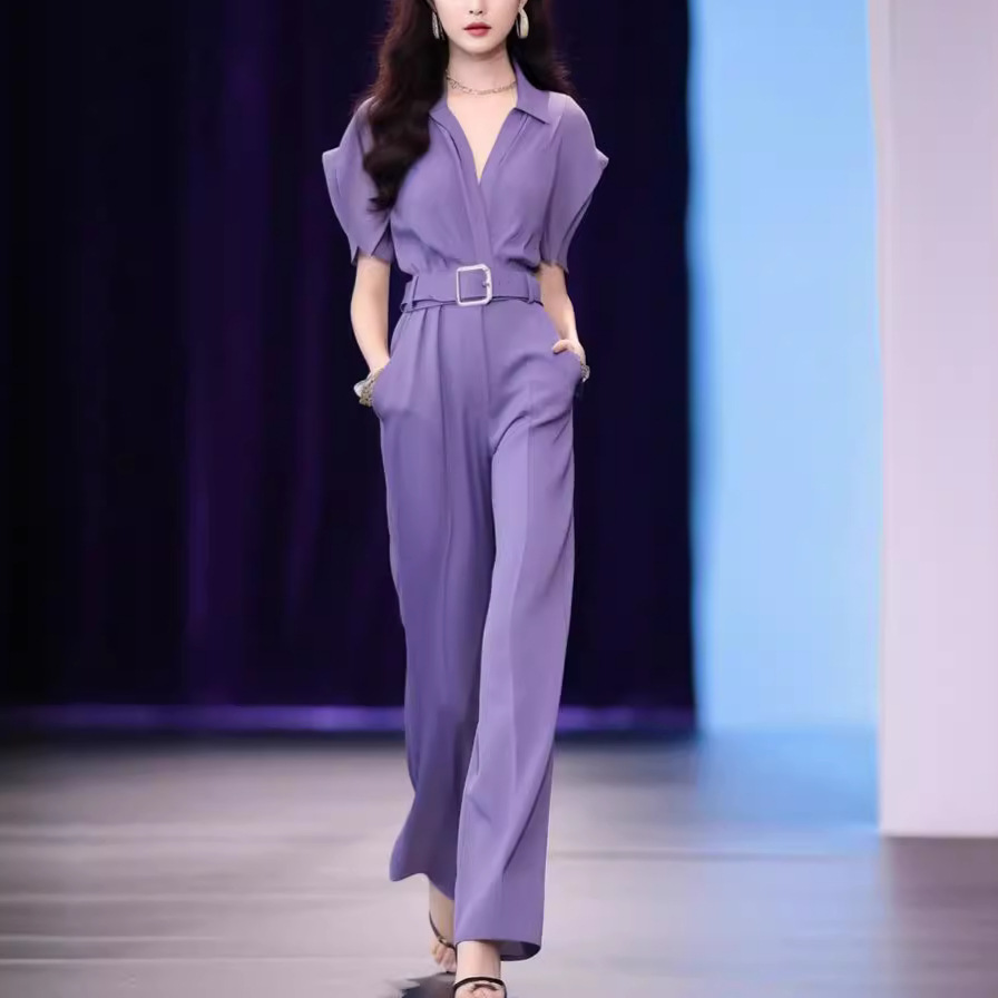 A sophisticated and elegant purple jumpsuit with a unique design, perfect for a chic and sophisticated look.