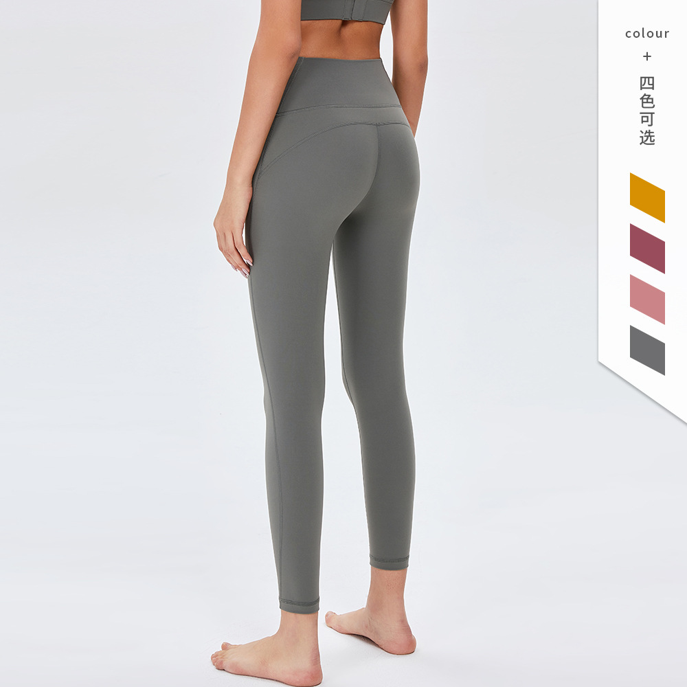 Pantalones de Yoga de cintura alta desnuda europea y americana de las mujeres Peach Hip lifting Pantalones deportivos ajustados pantalones de fitness de secado rápido