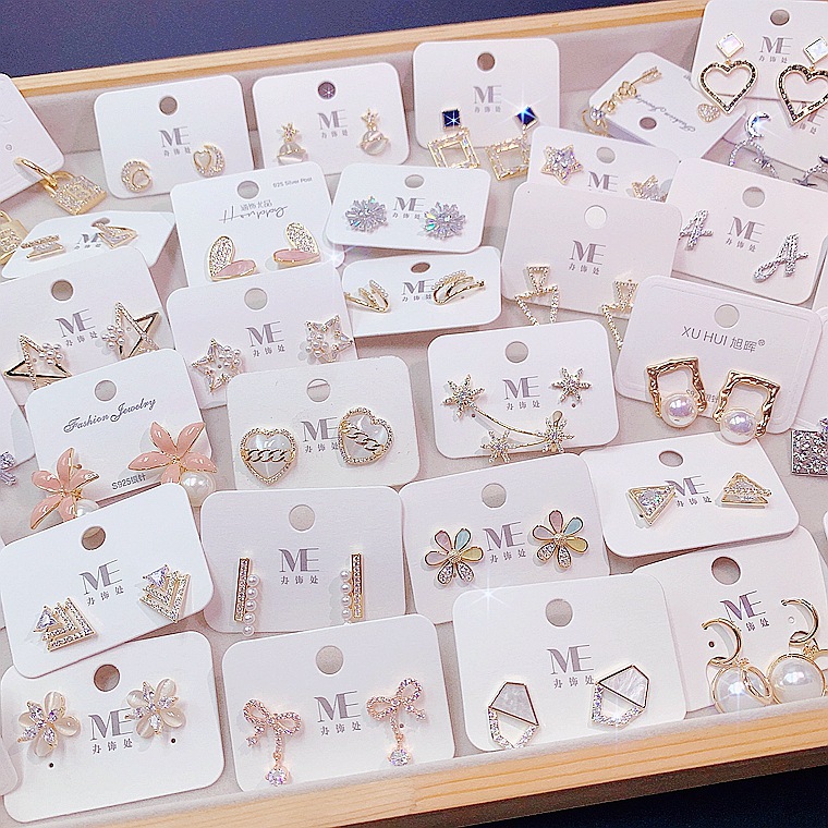Cute fashionable earrings from pearl with zircon