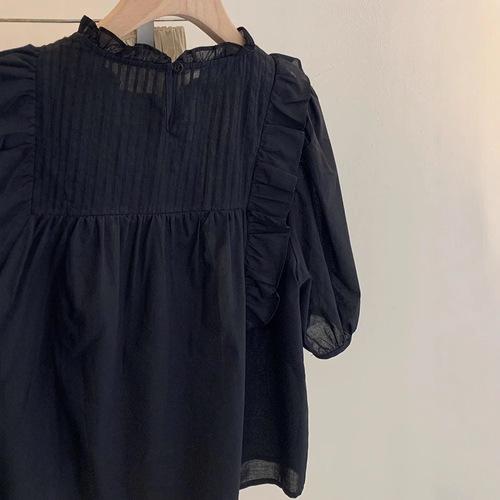 Black shirt with loose pleated ruffles, doll-style top—summer new arrival, forest-inspired solid color, sweet short-sleeved, niche design that won’t clash with others.