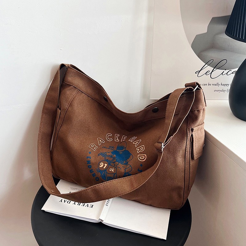 Wholesale large-capacity casual commuting women's single-shoulder bags, Korean-style trendy and fashionable handbags, LOGO printed canvas bags undefined
