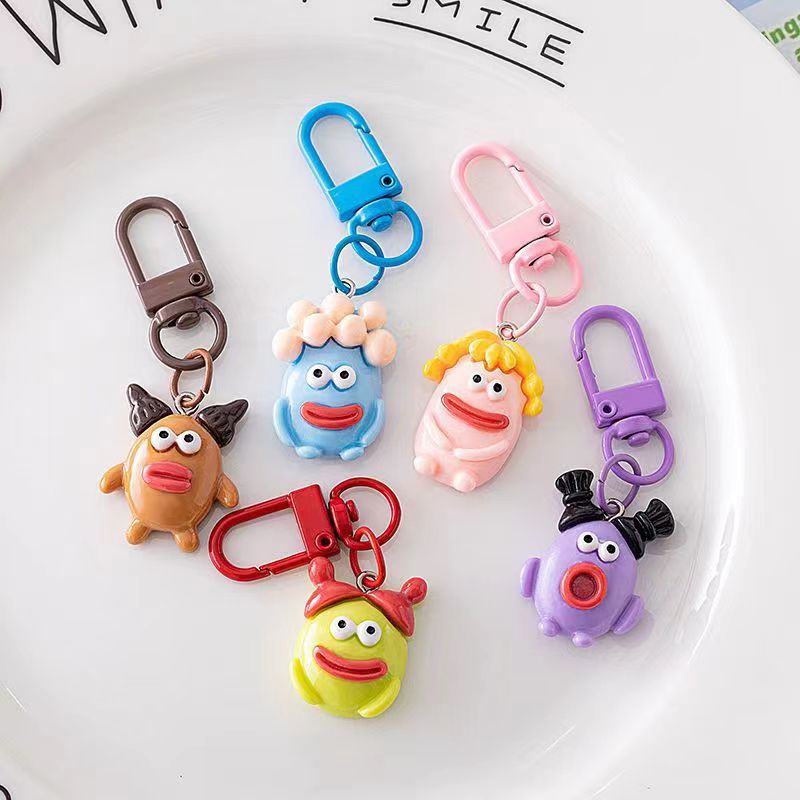 Bonita boca grande extraña llavero salchicha colgante estudiante pequeño libro rojo con accesorios colgante de color para amigos regalos