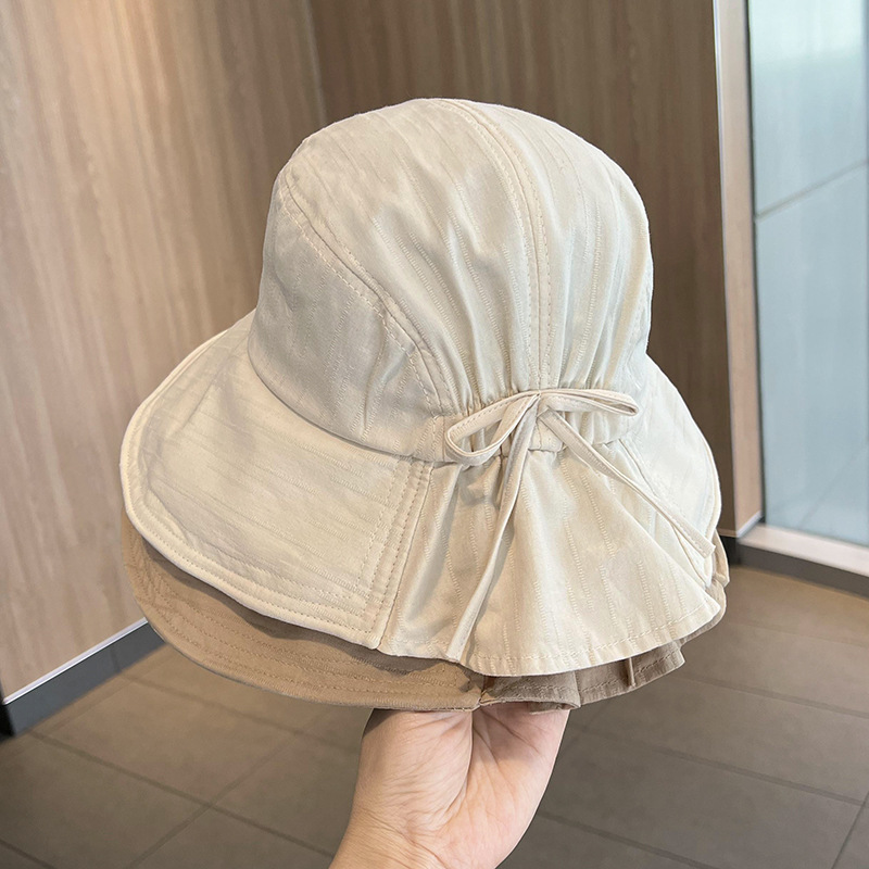 Korean-style bucket hat for women, summer thin design—perfect for outdoor trips, oversized head coverage, sun protection, with a bow detail to shield your face from the sun.