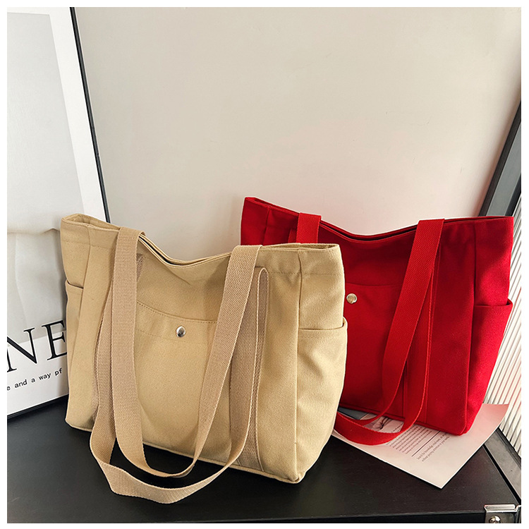 Wholesale of new women's single-shoulder bags, cross-border simple and casual canvas bags, Korean version LOGO printed commuter tote bags undefined