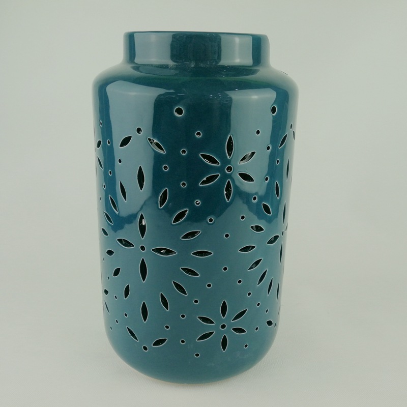 Moderno y simple cerámica nórdica LED linterna hueca vela candelabro decoración interior ligero de lujo lámpara de viento