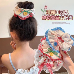 子供の甘い砕花大腸ヘアリング少女団子の頭の蝶結びの髪ひもの皮筋は髪ひもの髪飾りを傷つけない